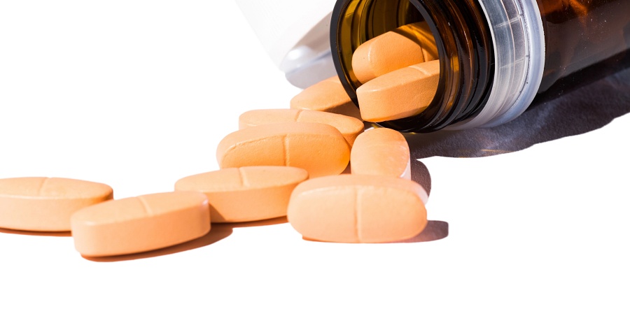 (portada) pastillas3 pastillas marrón claro con bote pote salen comprimidos